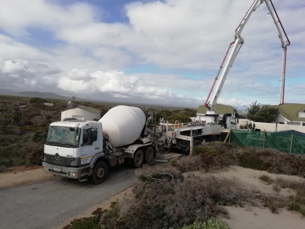 17 Here you can see one of the concrete trucks used to throw the raft foundation for a new house built by Okran61 from the ground up. Other than this concrete truck, there was also a pump truck used to quickly and efficiently help get the wet concrete to all the spots it needed to be. The pump truck was essential because the specific concrete mix dries very quickly. After the concrete was poured, another machine was used to remove bubbles from the concrete so that it could become compacted and strong.